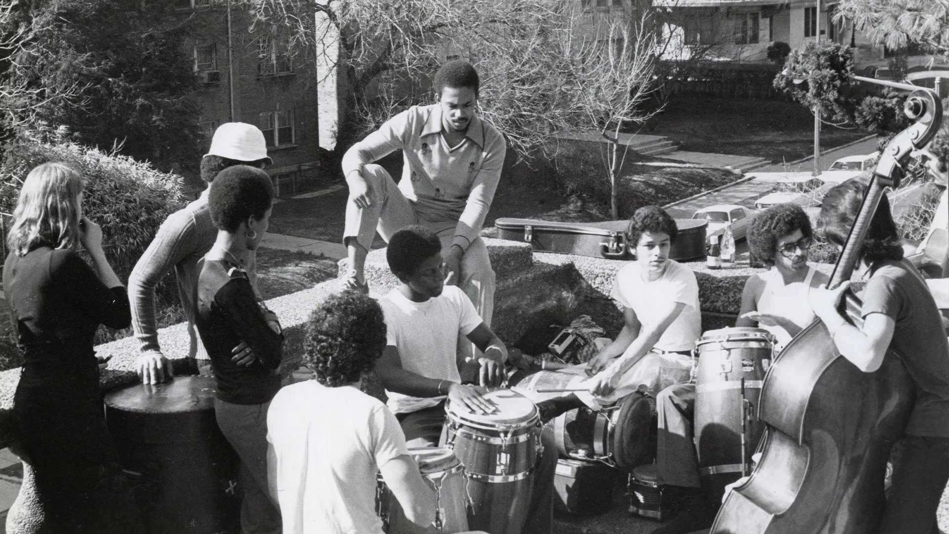 Neighborhood friends exploring African and Latin drum techniques with Pepe on upright bass in Malcolm X Park
